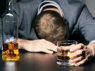 man-with-alcohol-in-hand-and-resting-head-on-table-732x549-thumb_0.webp